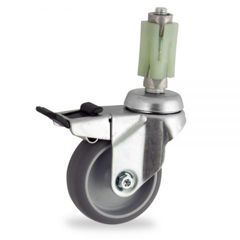 Zinc plated total lock caster 100mm for light trolleys,wheel made of grey rubber,double ball bearings.Fitting with square expander socket 24/27
