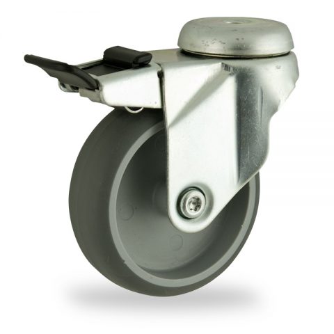 Zinc plated total lock caster 100mm for light trolleys,wheel made of grey rubber,double ball bearings.Hollow rivet