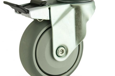 Zinc plated total lock caster 100mm for light trolleys,wheel made of grey rubber,single precision ball bearing.Top plate fitting