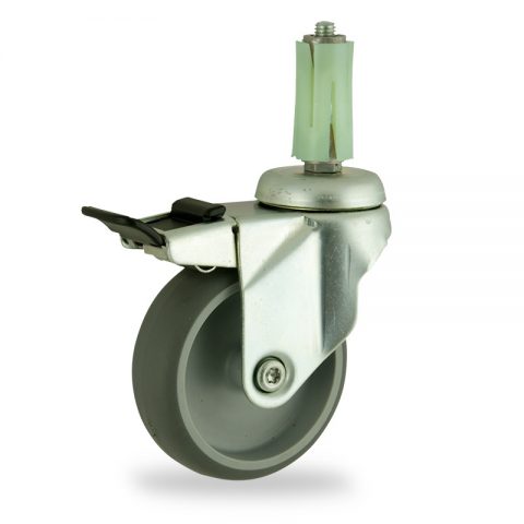 Zinc plated total lock caster 75mm for light trolleys,wheel made of grey rubber,double ball bearings.Fitting with round expander socket 26/30