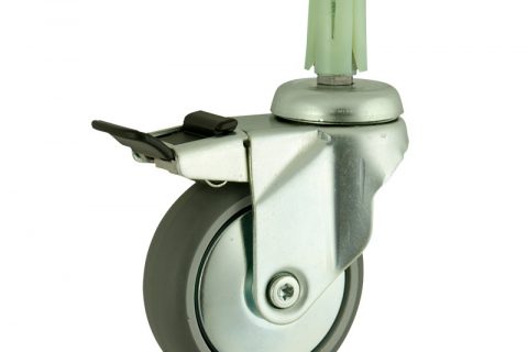 Zinc plated total lock caster 100mm for light trolleys,wheel made of grey rubber,double ball bearings.Fitting with round expander socket 19/23
