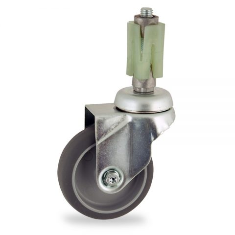 Zinc plated swivel caster 100mm for light trolleys,wheel made of grey rubber,double ball bearings.Fitting with square expander socket 21/24