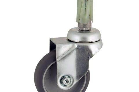Zinc plated swivel caster 100mm for light trolleys,wheel made of grey rubber,double ball bearings.Fitting with round expander socket 26/30
